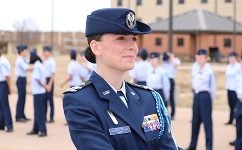 A Civil Air Patrol cadet standing in formation with their squadron